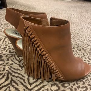 Leather fringe booties with a heel by Reba
